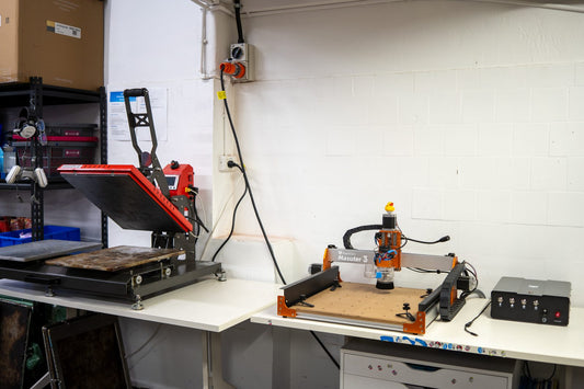 The MIR Press sheet press and FoxAlien Masuter 3 CNC router set up side by side in the Banish workshop