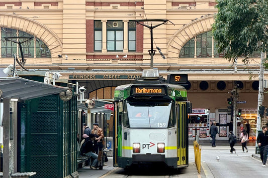 A Melbourne tram passing Flinders Street Station in the city centre