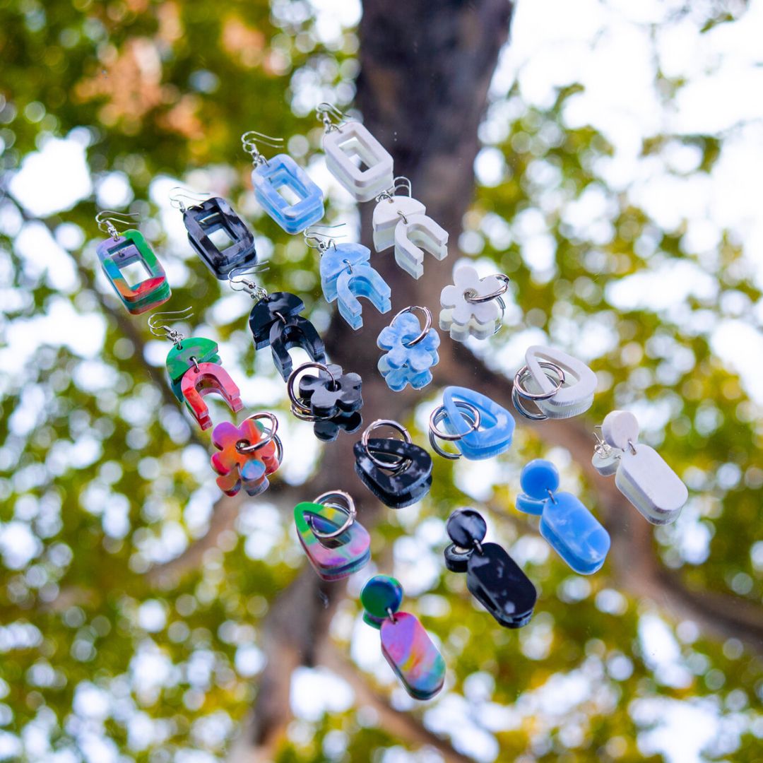 The five Banish recycled plastic earring styles handmade in Sydney from bottle top lids: Daisy, Aztec, Window, Droplet and Sail