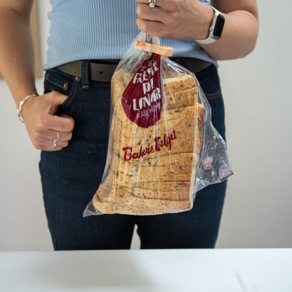 Recycled bag slide sealing a loaf of bread