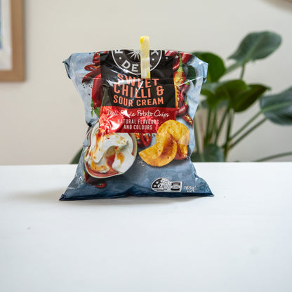 Recycled bag slide sealing a chip packet