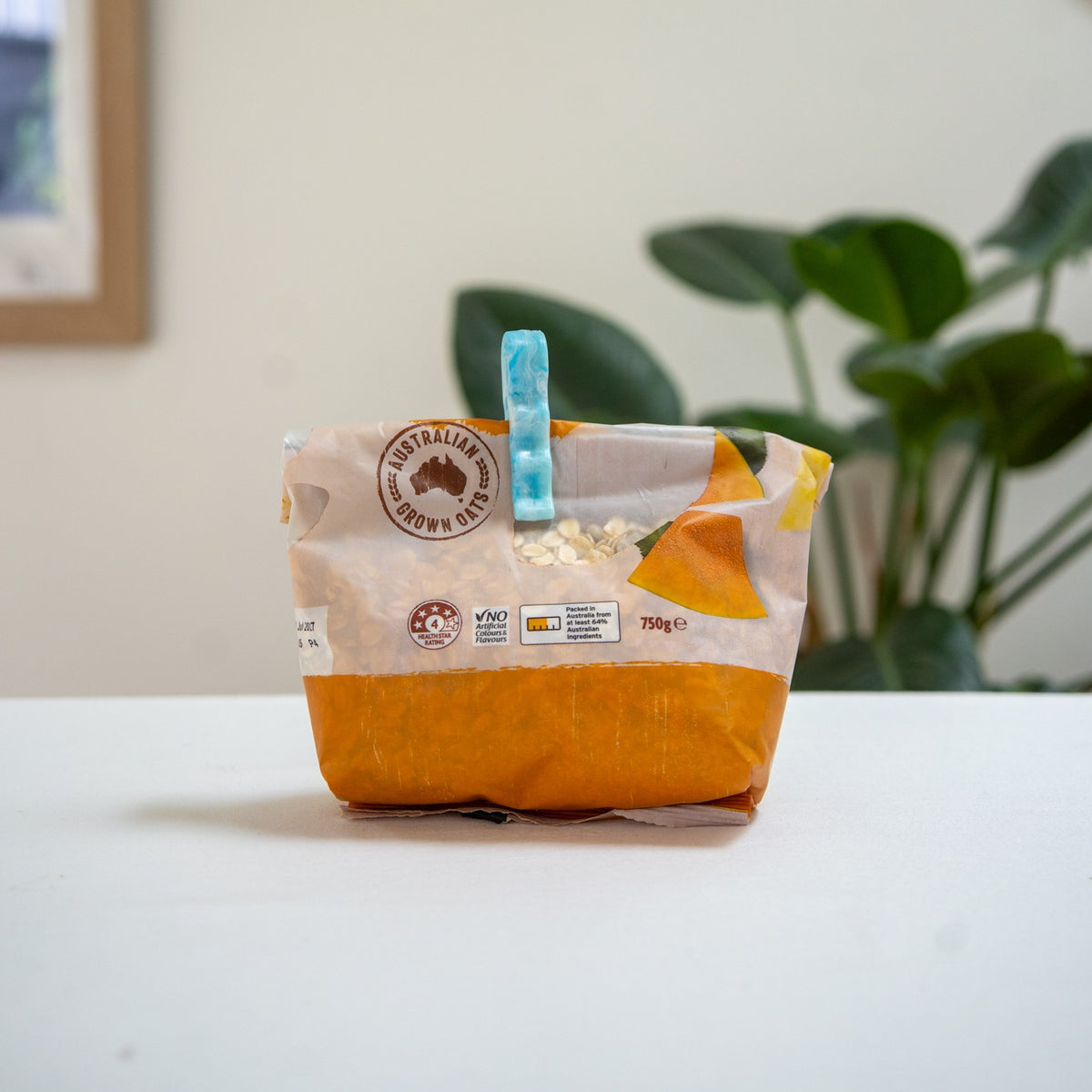 Recycled bag slide sealing a bag of rice