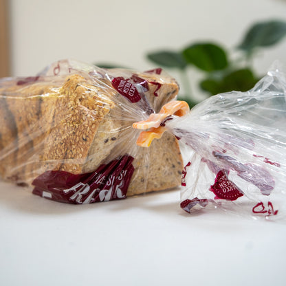 Recycled bag slide sealing a loaf of bread