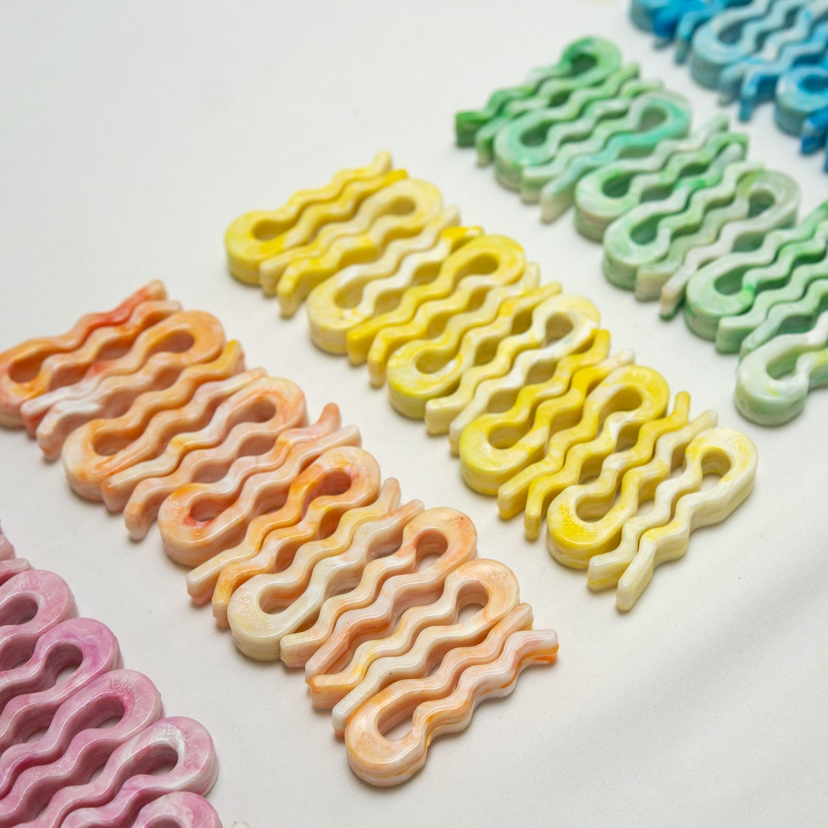 Rows of recycled bag slides in pink, orange, yellow, green and blue