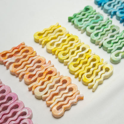 Rows of recycled bag slides in pink, orange, yellow, green and blue
